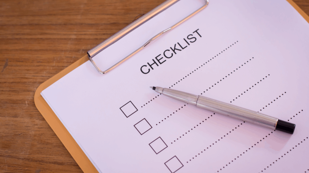 Startup checklist on a clipboard with pen
